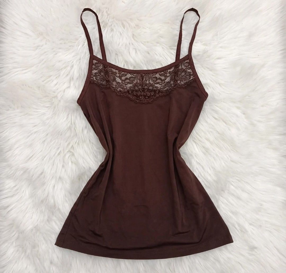 Brown Button-Up Blouse with Lace Detail (Category: Blouses) located in Manila. Submitted by angelic.clot (Listing ID 1463475909, Image 2). Description: - Brown long-sleeved blouse - Includes lace-trimmed camisole - Button-up front with decorative buttons - Pintuck details on the front - Perfect for layering or wearing solo.