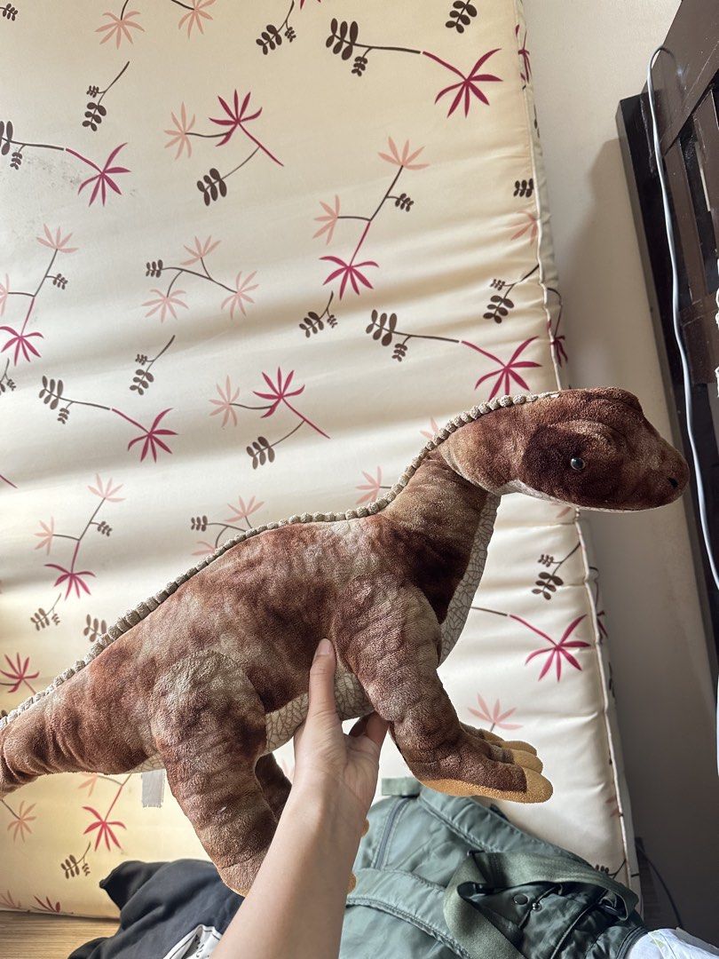 Brown Dinosaur Plush Toy Stuffed Animal (Category: Plushies & Soft Toys) located in Valenzuela. Submitted by shopwithmika (Listing ID 1463373486, Image 1). Description: - Adorable brown dinosaur plush toy - Super soft and cuddly material - Approximately 15 inches in length - Ideal gift for children or dinosaur enthusiasts - Eager to find its new forever home!.