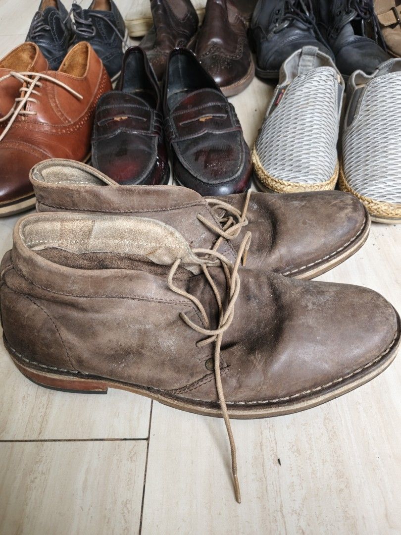 Brown Leather Chukka Boots (Category: Casual Shoes) located in Marikina City. Submitted by amari.stylesph (Listing ID 1463328953, Image 2). Description: Brown Leather Chukka Boots Style: Men's brown leather chukka boots Material: Appears to be genuine leather or leather-like material; cannot confirm without labels. Construction: Stitched leather outsole with rubber heel and sole inserts. Condition: Preloved, visibly worn, with surface scuffing, d