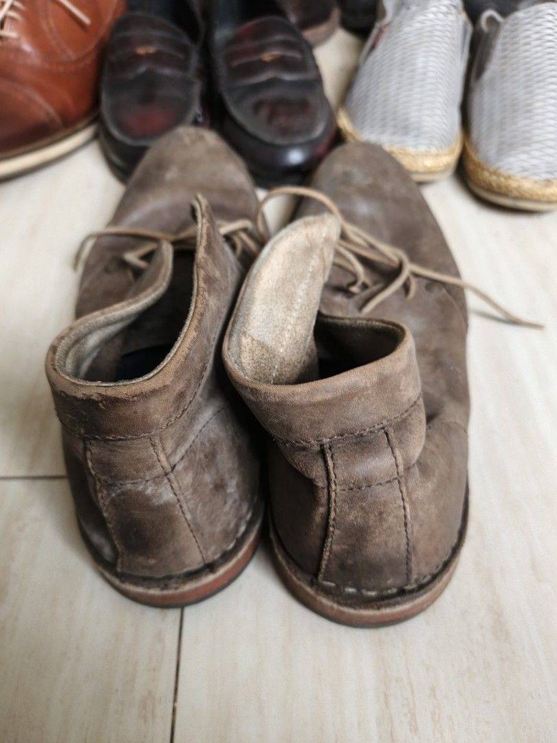 Brown Leather Chukka Boots (Category: Casual Shoes) located in Marikina City. Submitted by amari.stylesph (Listing ID 1463328953, Image 3). Description: Brown Leather Chukka Boots Style: Men's brown leather chukka boots Material: Appears to be genuine leather or leather-like material; cannot confirm without labels. Construction: Stitched leather outsole with rubber heel and sole inserts. Condition: Preloved, visibly worn, with surface scuffing, d