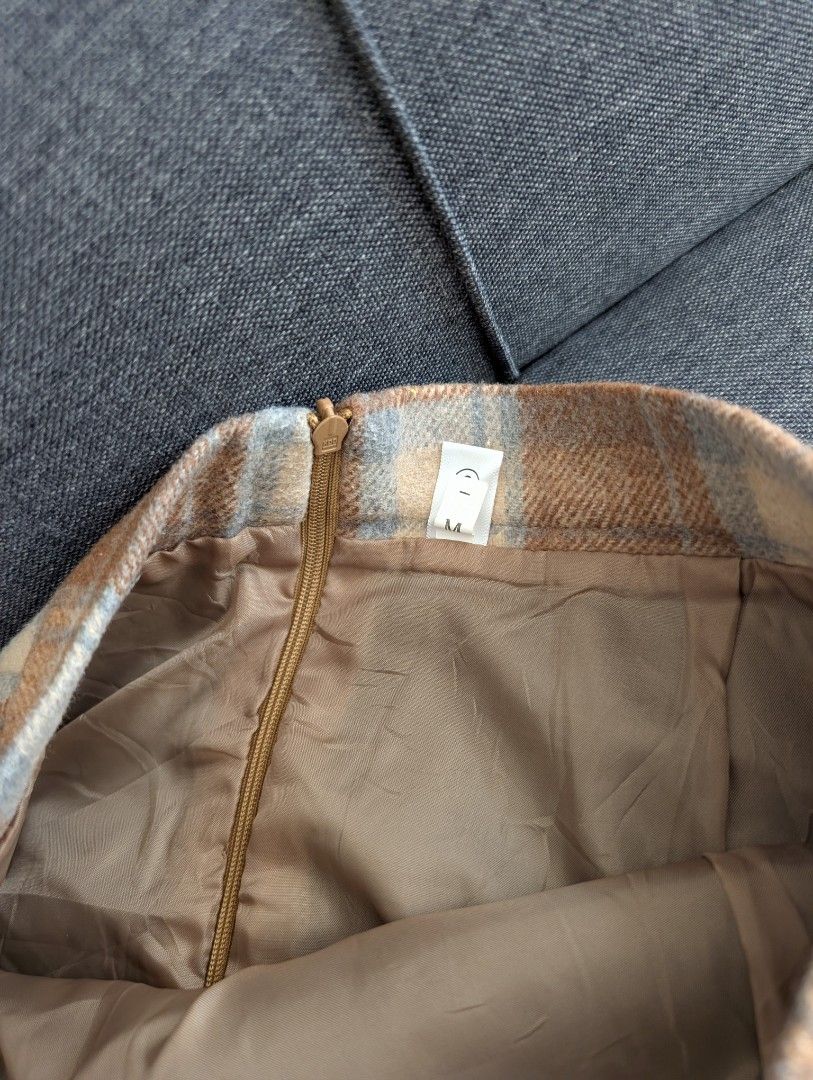 Brown Plaid Midi Skirt (Category: Skirts) located in Quezon City. Submitted by the4thstar.store (Listing ID 1463335660, Image 2). Description: - Cute brown plaid midi skirt - Back slit for easy movement - Zipper closure at the back - Fully lined inside.