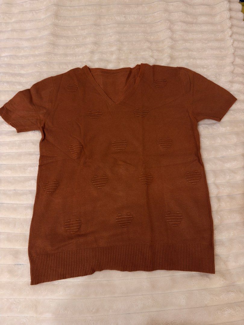 Brown V-Neck Short Sleeve Sweater with Heart Pattern (Category: Others Tops) located in Rizal. Submitted by rianaht (Listing ID 1463403194, Image 2). Description: Cute brown V-neck sweater - Can fit Medium to Large - Short sleeves - Textured heart pattern all over - Ribbed hem and cuffs 🌸 RFS: Decluttering 🌸 Delivery only to be shouldered by the buyer. 🌸 Payment via GCash / Maya / Maribank.