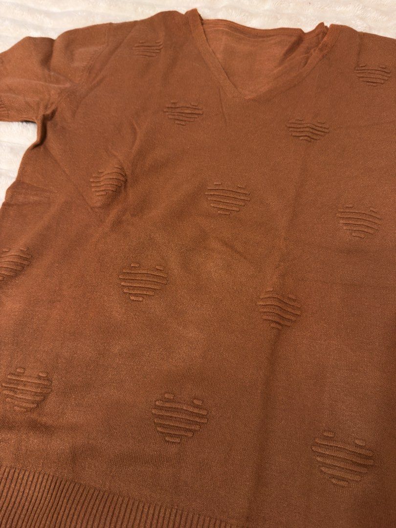 Brown V-Neck Short Sleeve Sweater with Heart Pattern (Category: Others Tops) located in Rizal. Submitted by rianaht (Listing ID 1463403194, Image 3). Description: Cute brown V-neck sweater - Can fit Medium to Large - Short sleeves - Textured heart pattern all over - Ribbed hem and cuffs 🌸 RFS: Decluttering 🌸 Delivery only to be shouldered by the buyer. 🌸 Payment via GCash / Maya / Maribank.