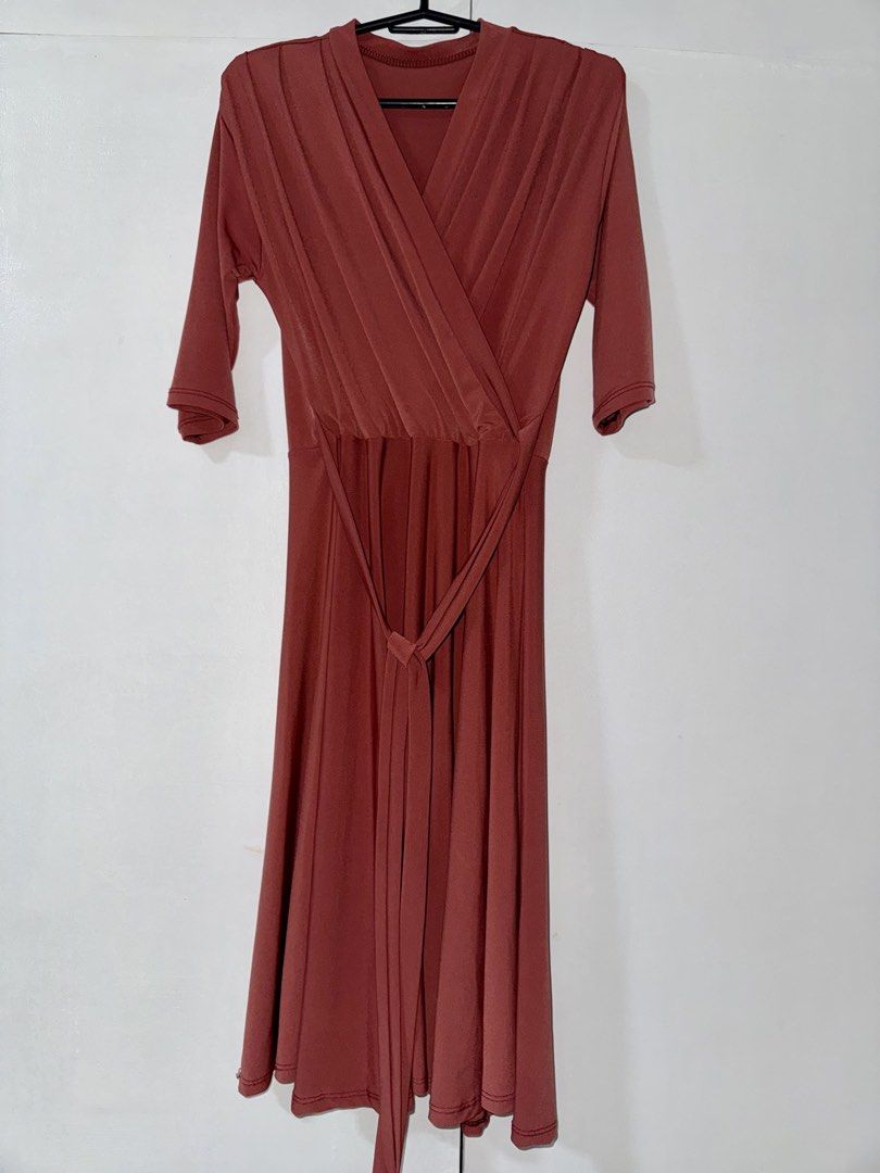 Brown Wrap Midi Dress with Belt (Category: Dresses) located in Manila. Submitted by marieladea47607 (Listing ID 1463486073, Image 1). Description: - Lovely reddish brown midi dress - Flattering wrap front design - Adjustable tie belt to cinch the waist - Comfortable three-quarter length sleeves - Beautiful drape and flared skirt - Versatile for casual or dressed-up looks.