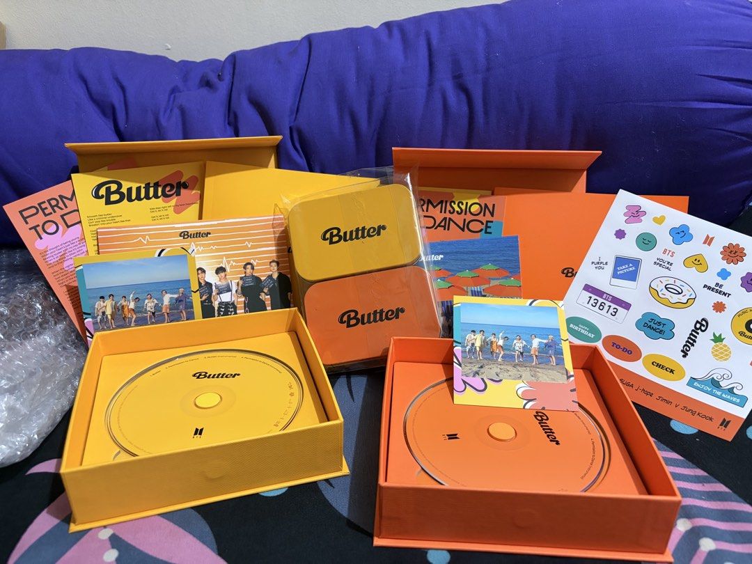 BTS Butter & Permission to Dance CD Set (Category: CDs & DVDs) located in Manila. Submitted by ahnamaesan06047 (Listing ID 1463395911, Image 3). Description: - BTS Butter & Permission to Dance CD Sets - Available in Yellow and Orange versions - Includes: CD, photocard, stickers, and more! - A must-have for any ARMY!.