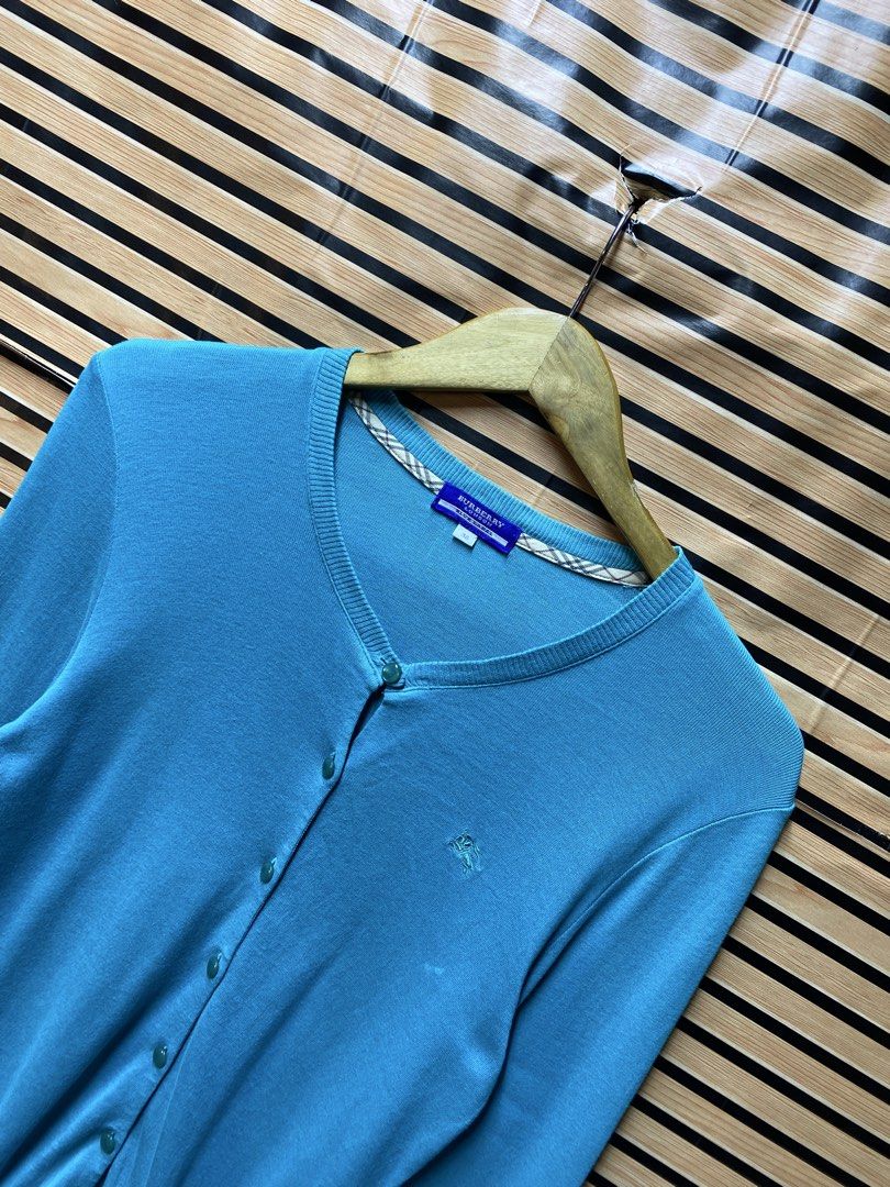 BURBERRY CARDIGAN (Category: Longsleeves) located in Makati City. Submitted by drip.poww (Listing ID 1463518928, Image 2). Description: - Authentic Burberry - Color: Light blue - Size: Meduim - Dimes: 20x23 - Authentic - Excellent condition - Need wash, fresh from bale - Material: 100% Cotton Please don’t expect too much—these are thrifted (ukay) items. 😊 !!STILL NEGOTIABLE!!.
