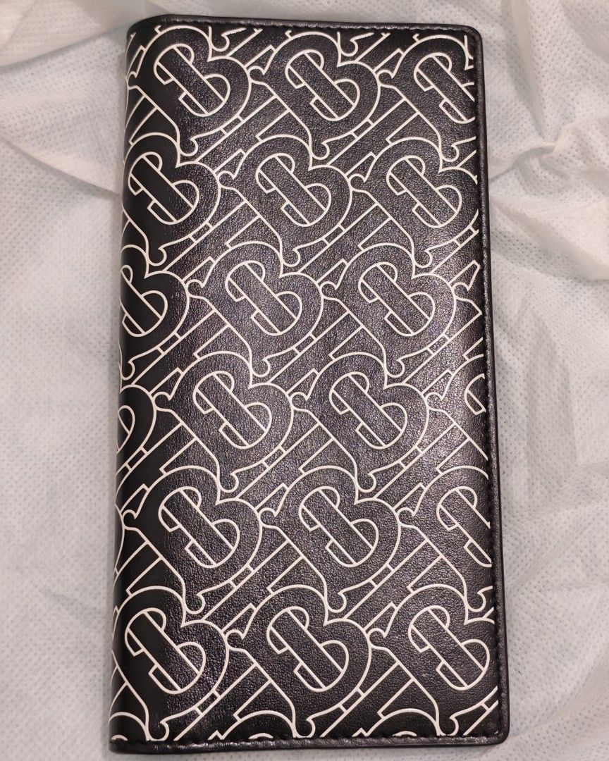 Burberry Long Wallet (Category: Wallets & Card Holders) located in Bacoor. Submitted by jadeitemaster (Listing ID 1463466246, Image 1). Description: Burberry TB Monogram Calf Leather 100% Authentic, no receipt or box. Decluttering my personal items. Purchased in Japan. Retail Price: 50000.