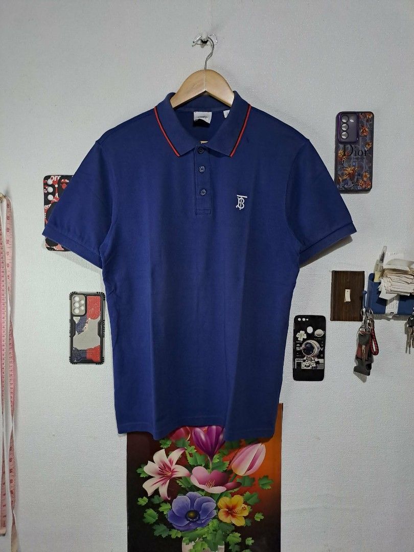 Burberry Monogram (Category: Luxury Apparel) located in Quezon City. Submitted by yaseen73 (Listing ID 1463383052, Image 1). Description: Authentic Thomas Burberry Monogram Embroidery Cotton Piquè Blue / Red Polo Shirt Wearing Size : Medium on Tag Dimensions : Please Refer to the Photo Color Rate : 9.5/10 - With Sign of Usage - Condition : 4.5/5 or Best Offer G C A S H B A N K T R A N S F E R Courier : J&T Lalamove Seller's Location : 📍Brgy. Pan