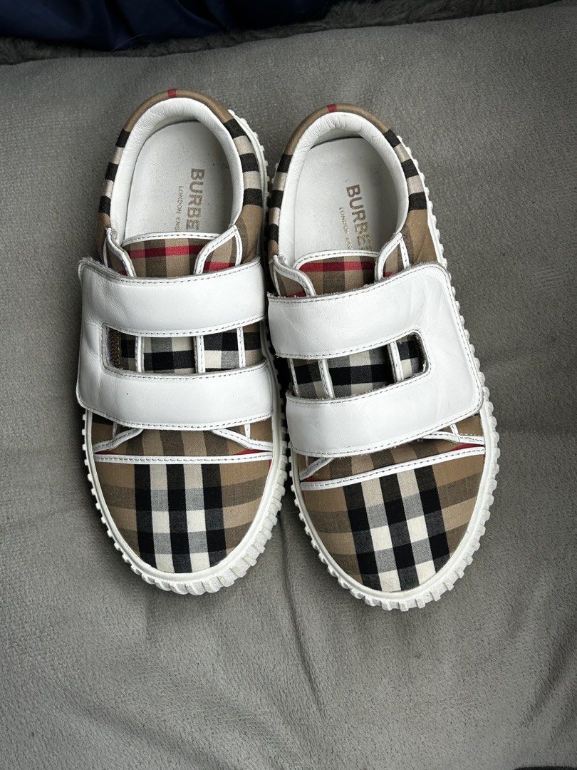 Burberry Nova Check Sneakers with White Straps (Category: Sneakers) located in Cebu City. Submitted by yenetcuba52435 (Listing ID 1463331930, Image 1). Description: - Iconic Burberry Nova Check pattern - White leather straps for a secure fit - Burberry logo embossed on soles - Ideal for casual wear - Adds a stylish touch to any outfit Pambata.