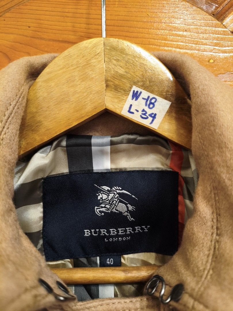 Burberry Trench Coat 🔥 (Category: Luxury Apparel) located in Rizal. Submitted by cs_luxurythrift (Listing ID 1463396116, Image 3). Description: - Classic Burberry trench coat - Size 40 - Double-breasted style - Belted waist - Iconic Burberry check lining - Made from a cashmere blend - Ideal for layering.