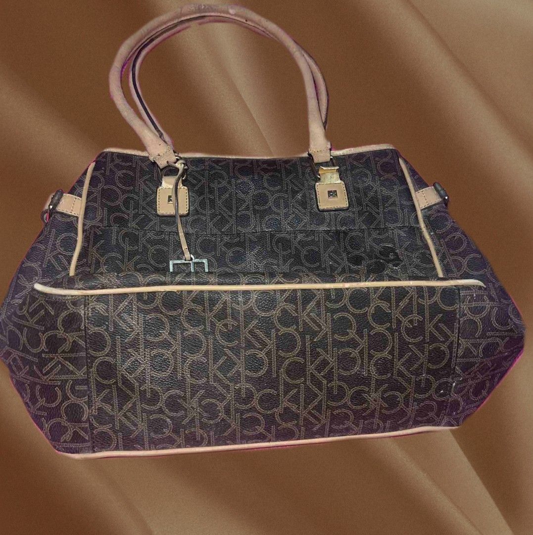 Calvin Klein Brown Tote Bag (Category: Tote Bags) located in Rizal. Submitted by youngpenguin.ae303d (Listing ID 1463357966, Image 3). Description: Decluttering Note: This bag has visible signs of use, as shown in the photos. Minor scratches and marks are visible..
