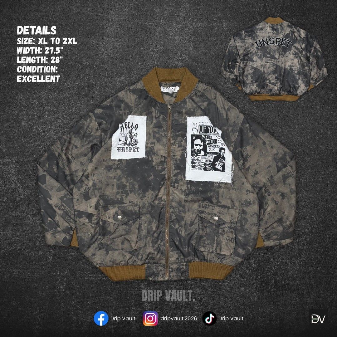 Camo Bomber Jacket (Category: Coats, Jackets and Outerwear) located in Manila. Submitted by drip_vault.ph2026 (Listing ID 1463496584, Image 1). Description: 🔥Camo Bomber Jacket (Unspet – Punk Patch)🔥 Price: ₱299 Condition: Excellent Issue: None Details: Size: XL to 2XL Width: 27.5" Length: 28 Condition: Excellent ⚠️PLEASE NOTE: 📍 Please allow 1-3 cm difference due to manual measurement 📍 Colors may slightly vary due to lighting and screen set