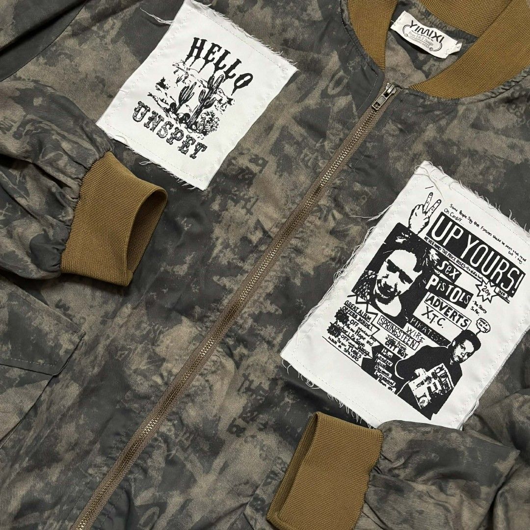 Camo Bomber Jacket (Category: Coats, Jackets and Outerwear) located in Manila. Submitted by drip_vault.ph2026 (Listing ID 1463496584, Image 2). Description: 🔥Camo Bomber Jacket (Unspet – Punk Patch)🔥 Price: ₱299 Condition: Excellent Issue: None Details: Size: XL to 2XL Width: 27.5" Length: 28 Condition: Excellent ⚠️PLEASE NOTE: 📍 Please allow 1-3 cm difference due to manual measurement 📍 Colors may slightly vary due to lighting and screen set