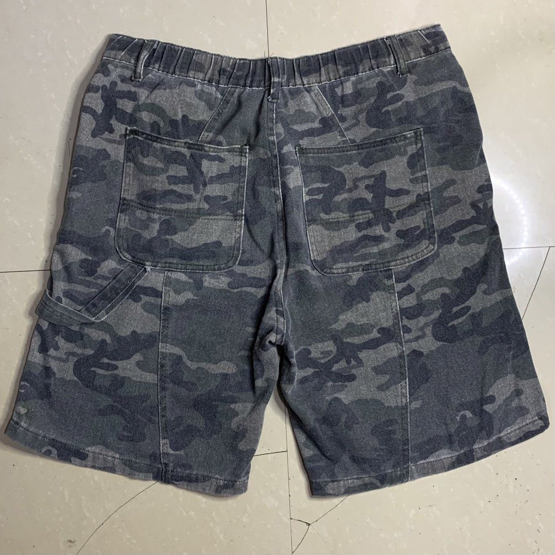 Camo Denim Shorts (Category: Activewear) located in Alaminos. Submitted by jikstocks (Listing ID 1463484859, Image 3). Description: - Grey camouflage denim shorts - Elastic waistband with button and zip closure - Multiple pockets on front and back - Utility loop on the side - Ideal for casual wear - Comfortable fit.
