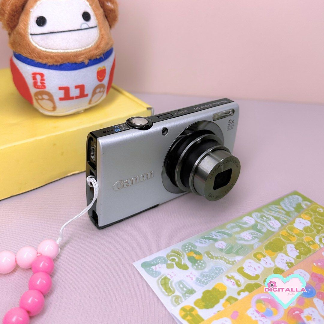 Canon Powershot A2300 Digigal Camera Digicam (Category: Cameras) located in Iloilo. Submitted by alyssadia (Listing ID 1463350940, Image 1). Description: 𝐂𝐚𝐧𝐨𝐧 𝐏𝐨𝐰𝐞𝐫𝐒𝐡𝐨𝐭 𝐀𝟐𝟑𝟎𝟎 (𝐒𝐢𝐥𝐯𝐞𝐫) — ₱4,999 ✧･ﾟ🤍📸 ┆ ⤿ 🌸 . ݁˖ 𝐃𝐄𝐓𝐀𝐈𝐋𝐒 ✧ 16MP CCD Sensor ✧ 5x Optical Zoom Lens ✧ 720p HD Video Recording ✧ Smart Auto Mode ✧ Body Condition: 8/10, minor signs of usage ┆ ⤿ ❕. ݁˖ 𝐈𝐒𝐒𝐔𝐄𝐒 ✧ LCD burn, see photos ┆ ⤿ 💌 . ݁˖ 𝐈𝐍𝐂𝐋