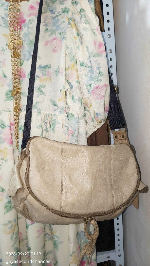 CARGO STYLE LEATHER CROSSBODY BAG (Category: Shoulder Bags) located in Kalibo. Submitted by secondchances.thriftsh8p (Listing ID 1463530257, Image 3). Description: - Cool beige leather shoulder bag - Main zip compartment - Front zip pocket - Adjustable black fabric strap - Signs of wear on leather and hardware (vintage vibe) - Spacious interior - Perfect for everyday use.