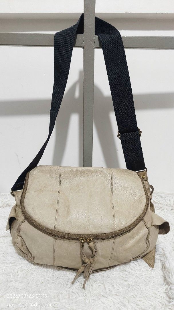 CARGO STYLE LEATHER CROSSBODY BAG (Category: Shoulder Bags) located in Kalibo. Submitted by secondchances.thriftsh8p (Listing ID 1463530257, Image 1). Description: - Cool beige leather shoulder bag - Main zip compartment - Front zip pocket - Adjustable black fabric strap - Signs of wear on leather and hardware (vintage vibe) - Spacious interior - Perfect for everyday use.