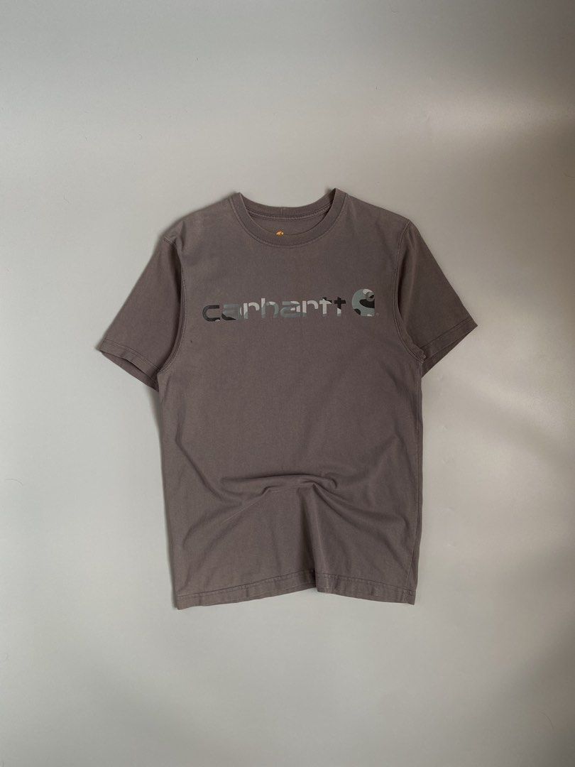 CARHARTT Camou Script Tee (Category: Tshirts & Polo Shirts ) located in Cavite. Submitted by awuuu27 (Listing ID 1463489269, Image 1). Description: CARHARTT Camou Script Tee 💎 DIMES: Width-23/Length-29 (L-XL) CONDITION: 9/10 COLOR RATE: 9/10 ISSUE: black stain, need wash, minimal sunfade sa neckline .
