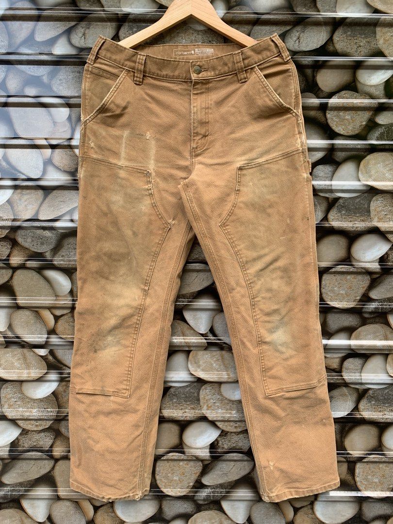Carhartt Work Pants Tan Double Knee Carpenter Style (Category: Jeans) located in Aloran. Submitted by chester78864 (Listing ID 1463493410, Image 3). Description: - Classic tan Carhartt work pants - Iconic double knee design for extra durability - Multiple pockets for ample storage - Authentic worn-in look from use - Ideal for everyday wear or DIY projects.