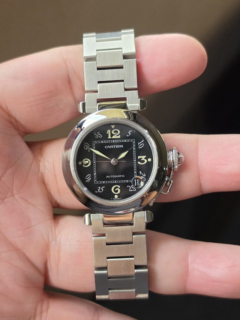 Cartier Pasha C Complete (Category: Luxury Watches) located in Binan City. Submitted by migs.tolentino (Listing ID 1463453678, Image 1). Description: Selling a Cartier Pasha C W31043M7. Black dial with lume. Automatic movement. 35mm unisex case size. Smooth sapphire crystal. All functions working. Rating it 9.5/10 condition. Comes with complete bracelet links, box, Cartier certificate and papers. No trades. Preferred meetups in Alabang, Laguna or