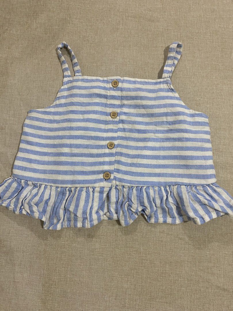 Cat & Jack Denim Jacket & Striped Tank Top Set (Category: Babies & Kids Fashion) located in Lucena. Submitted by selenaandco (Listing ID 1463416269, Image 3). Description: - Cute kids' denim jacket - Blue and white striped tank top with ruffled hem and button details - Great for casual outings or layering.