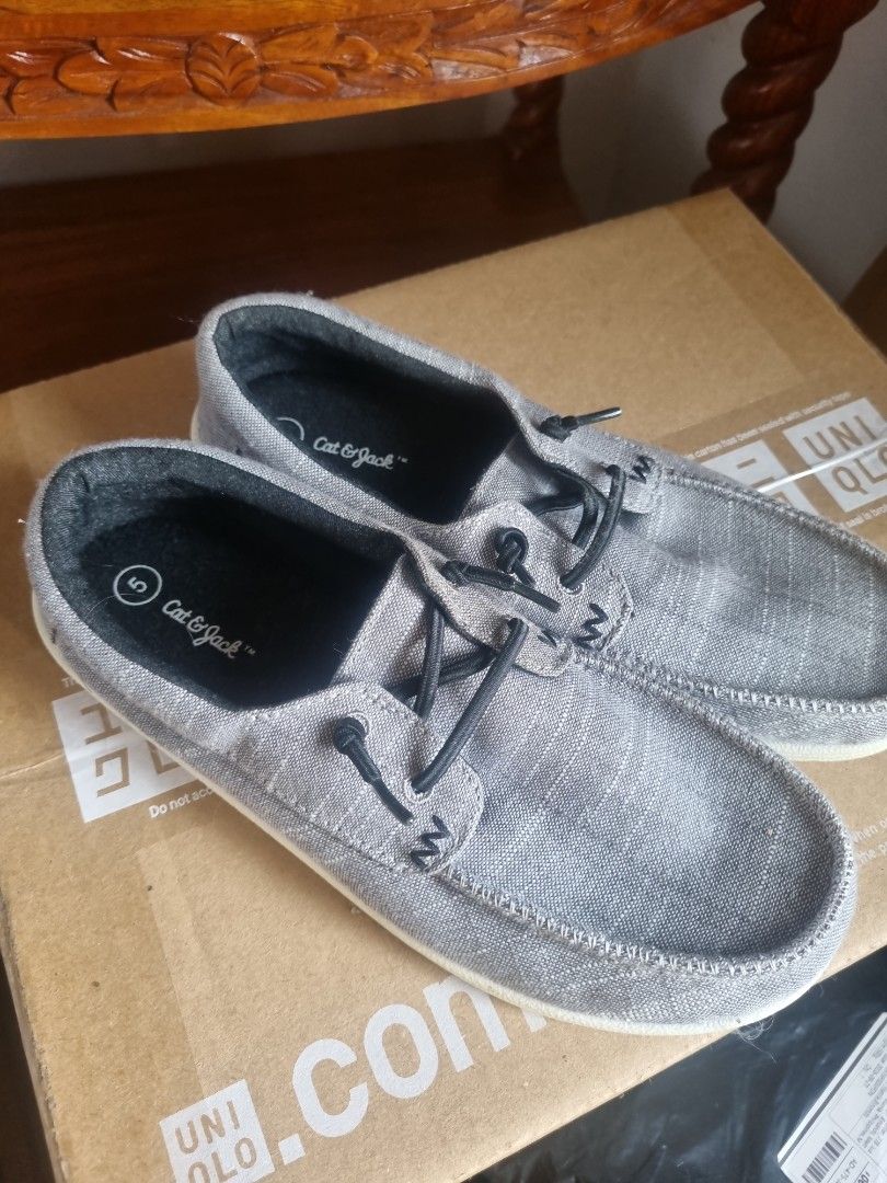 Cat & Jack Grey Canvas Slip-On Shoes (Category: Sneakers) located in Caloocan City. Submitted by maumau.247 (Listing ID 1463401639, Image 3). Description: - Grey canvas slip-on shoes by Cat & Jack - Easy to wear, just slide on! - Decorative laces for style - Features a flexible sole - Perfect for casual wear.