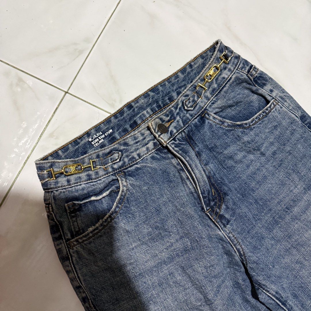 CELINE Dylan Flared Jeans with Chain Detail (Category: Jeans) located in Manila. Submitted by preciousma24494 (Listing ID 1463412587, Image 3). Description: - Blue wash denim jeans 27-28 length:38 - Flared leg style - Gold chain detail at waistband - Button and zip closure - Classic five-pocket design - Perfect for a stylish outfit.
