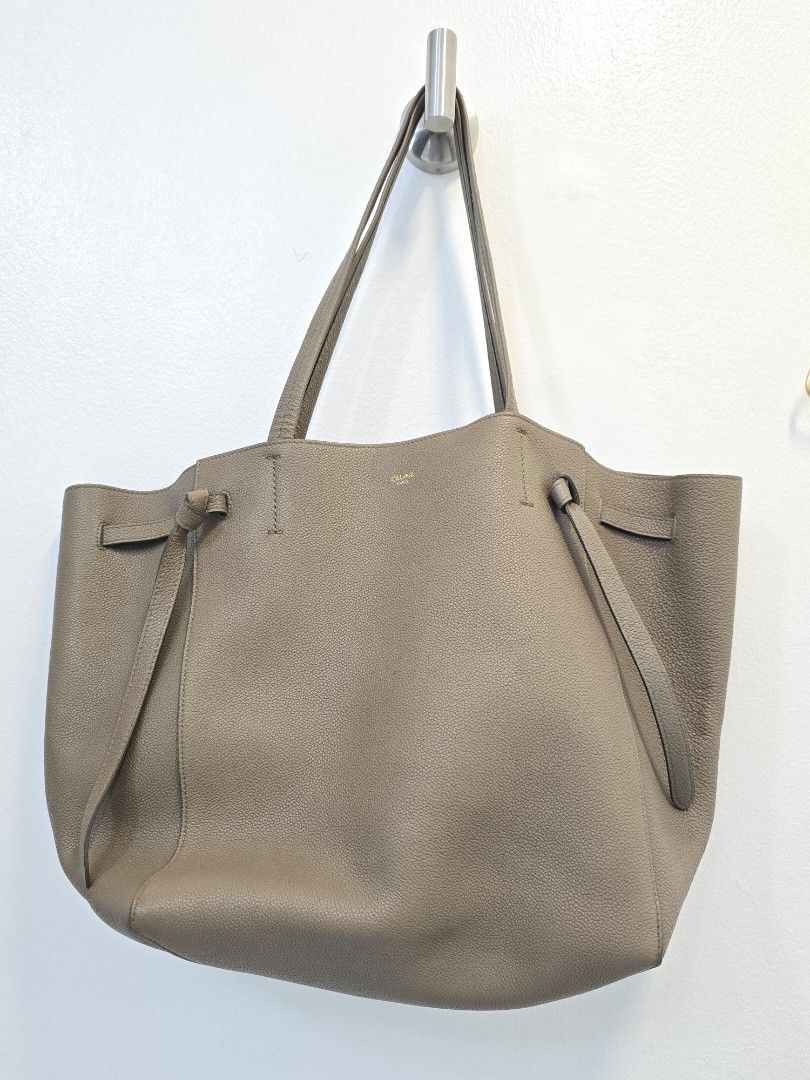 Celine Leather Cabas Tote Bag (Category: Luxury Bags & Wallets) located in Las Pinas. Submitted by vanpru (Listing ID 1463364117, Image 1). Description: - Taupe pebbled leather tote bag - Spacious interior with zip and slip pockets - Secure drawstring closure - Minimalist and versatile design - Ideal for everyday use - impulse buying. decluttering..
