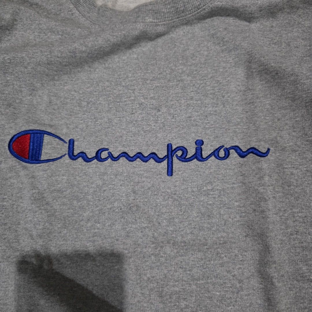 Champion Grey Crewneck Sweatshirt (Category: Coats, Jackets and Outerwear) located in Quezon City. Submitted by kick_mnl (Listing ID 1463374109, Image 2). Description: - Grey Champion sweatshirt - Classic vertical embroidered logo on front - Smaller logo embroidered on sleeve - Crewneck style - Made from comfortable material - Ideal for casual wear.