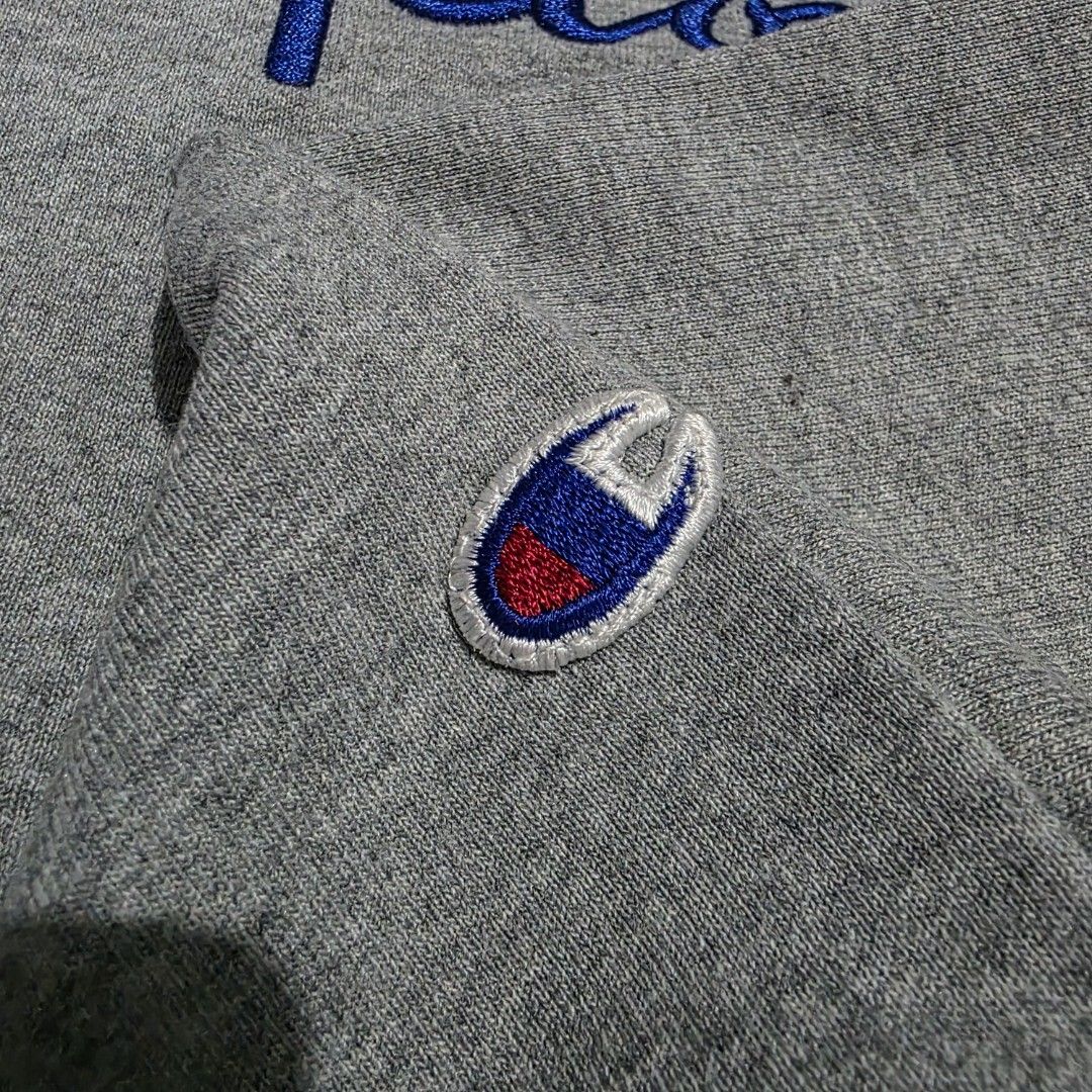 Champion Grey Crewneck Sweatshirt (Category: Coats, Jackets and Outerwear) located in Quezon City. Submitted by kick_mnl (Listing ID 1463374109, Image 3). Description: - Grey Champion sweatshirt - Classic vertical embroidered logo on front - Smaller logo embroidered on sleeve - Crewneck style - Made from comfortable material - Ideal for casual wear.