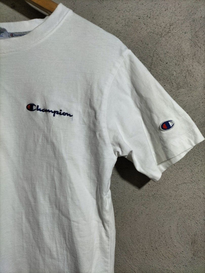 Champion White T-Shirt Small (Category: Tshirts & Polo Shirts ) located in Valencia. Submitted by cabisaythriftshop (Listing ID 1463419139, Image 2). Description: - Classic white Champion t-shirt - Embroidered Champion logo on chest and sleeve - Tagged size Small - Ideal for everyday wear - Simple and comfortable design.
