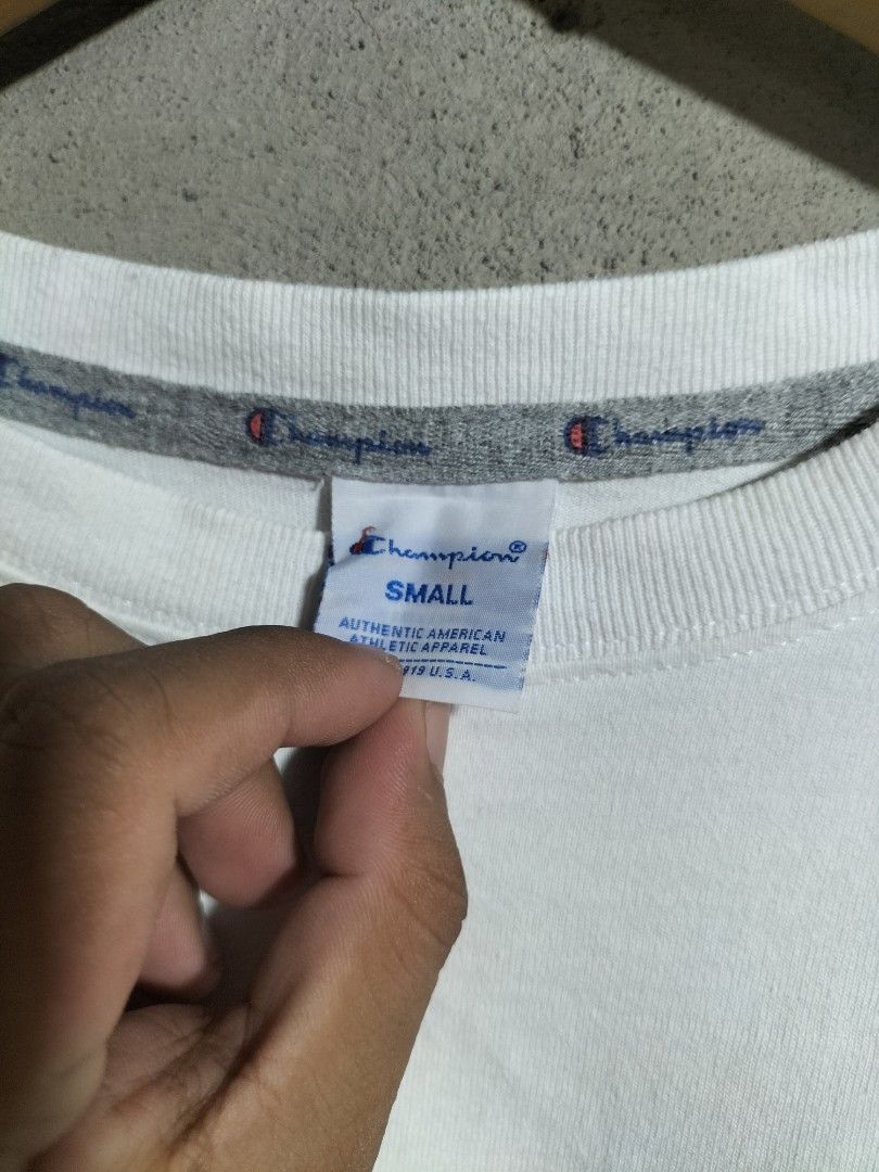 Champion White T-Shirt Small (Category: Tshirts & Polo Shirts ) located in Valencia. Submitted by cabisaythriftshop (Listing ID 1463419139, Image 3). Description: - Classic white Champion t-shirt - Embroidered Champion logo on chest and sleeve - Tagged size Small - Ideal for everyday wear - Simple and comfortable design.
