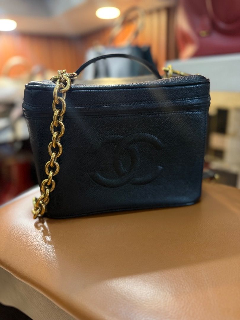 Chanel Black Caviar Leather Vanity Case Bag (Category: Luxury Bags & Wallets) located in Caloocan City. Submitted by piamariemo11606 (Listing ID 1463345882, Image 2). Description: - Authentic Chanel Vanity Case - Material: Black Caviar Leather - Hardware: Gold Chain Strap and Hardware - Includes: Lock, Keys, Authenticity Card - Versatile: Ideal for travel or everyday use - A timeless Chanel classic.