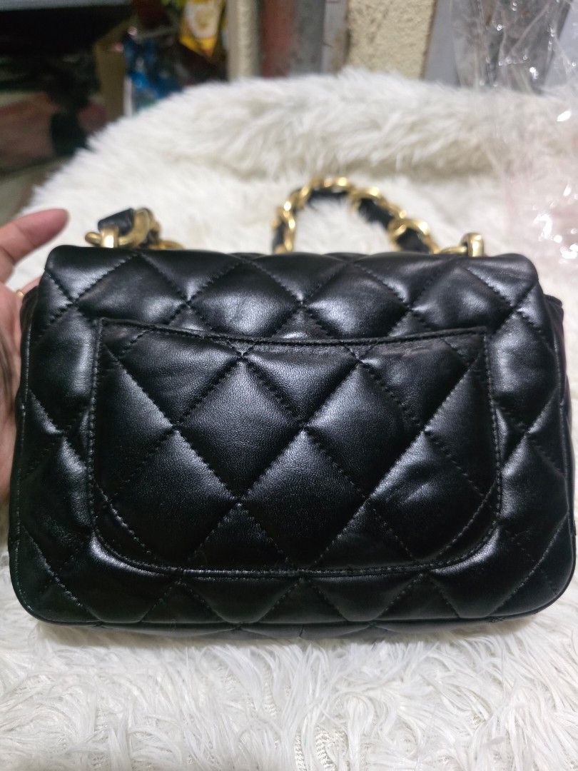 Chanel Black Quilted Leather Chain Shoulder Bag (Category: Luxury Bags & Wallets) located in Lemery. Submitted by venus23 (Listing ID 1463423888, Image 2). Description: - Classic black quilted leather handbag - Gold-tone chunky chain strap - Turn-lock closure with Chanel logo - Perfect size for essentials - Versatile for day or night use.