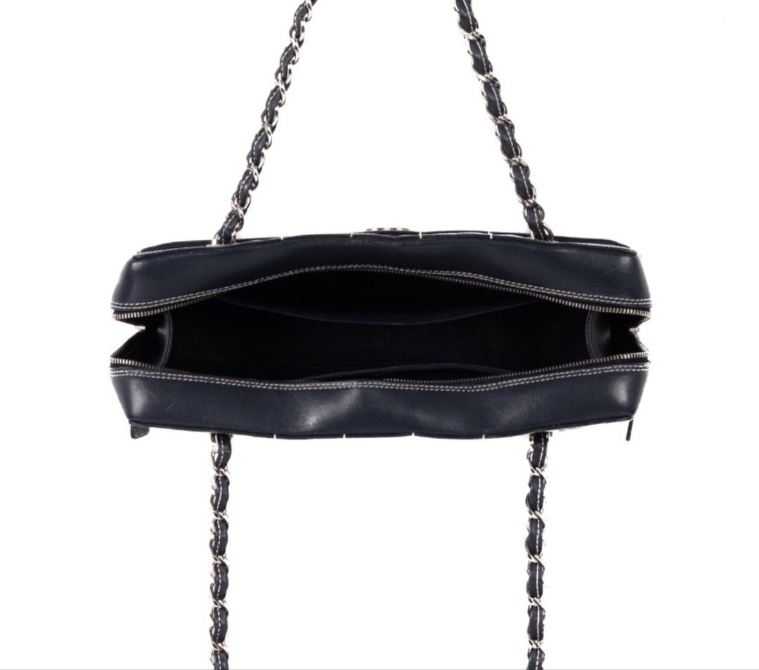 CHANEL Chocolate Bar Black Square Stitch Bag (Category: Luxury Bags & Wallets) located in Taguig. Submitted by luxeinofficial (Listing ID 1463348552, Image 3). Description: CHANEL Chocolate Bar Black Square Stitch Bag SKU: Y2H7GP Gender: Ladies Material: Lambskin leather Stamp: 7037705 Year: 2002 - 2003 Interior: One zip pocket, one open pocket and one main compartment Measurements: 11.5”L X 3.4”W X 6.75”H Handle Drop: 9.1” Hardware: Silver tone 