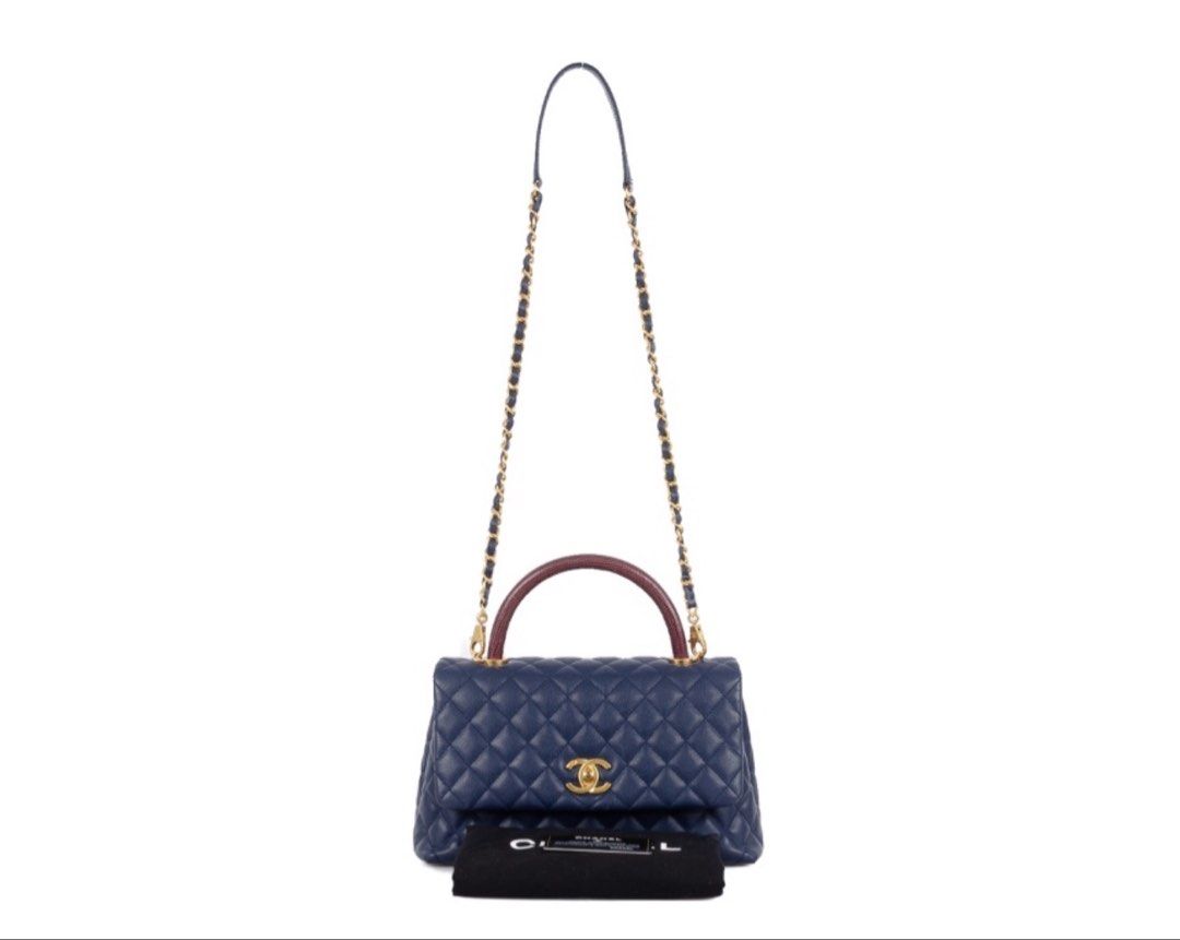 CHANEL Coco Small Navy/Burgundy Leather Lizard Top Handle Bag (Category: Luxury Bags & Wallets) located in Taguig. Submitted by luxeinofficial (Listing ID 1463350562, Image 2). Description: CHANEL Coco Small Navy/Burgundy Leather Lizard Top Handle Bag SKU: 1LKF4D Gender: Ladies Material: Caviar leather and lizard leather Stamp: 24077468 Year: 2017-2018 Interior: One main compartment, one zipper pocket, one pen pocket and two open pockets Measurem