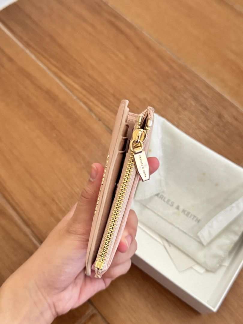 Charles & Keith Bifold Wallet (Category: Wallets & Card holders) located in Manila. Submitted by clutterfinds_ (Listing ID 1463351360, Image 3). Description: > 💯 original! (money back if proven fake) > comes with it’s original box > with very minimal flaw. no scratches > in pristine condition > retails for ₱1,399 on CNK website.