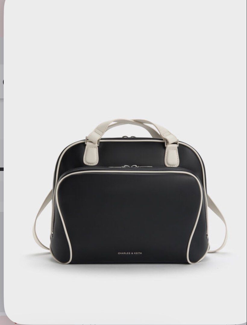 Charles & Keith Black and White Handbag (Category: Luxury Bags & Wallets) located in Carmona. Submitted by allonahkhrizelle-96238 (Listing ID 1463515222, Image 2). Description: This item is part of our Online Exclusive selection, which consists of unique colourways and designs that are only available for purchase online. This Nelly backpack has a black body with white straps and trims. It also features a roomy front pocket and soft top handles. C