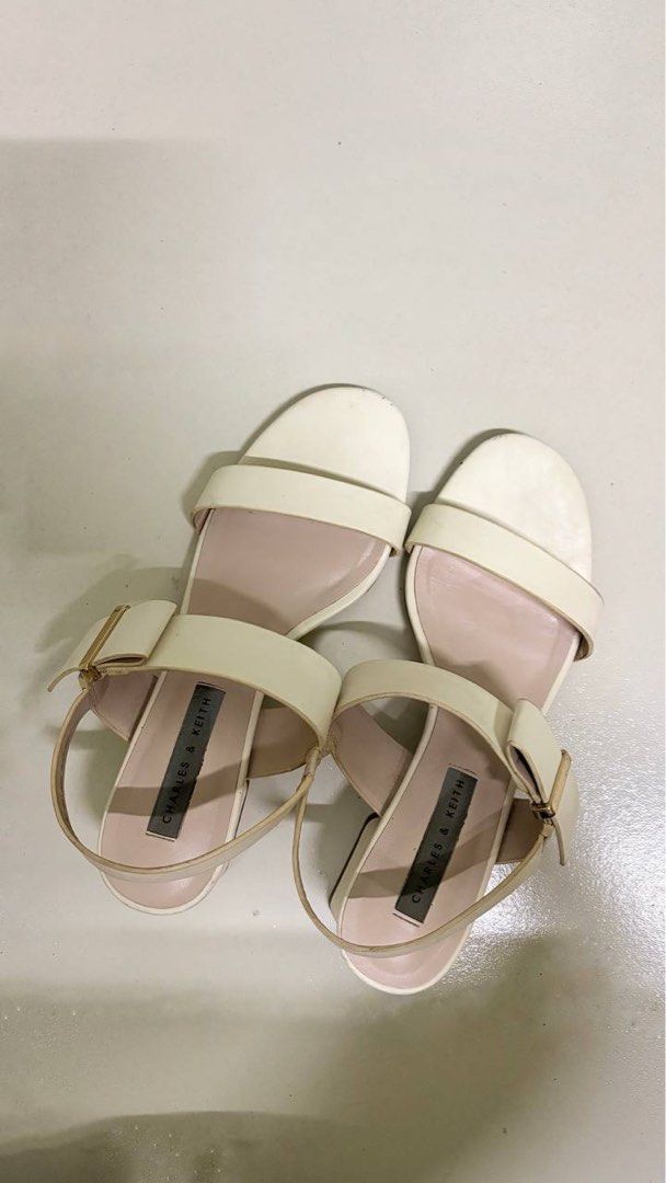 Charles & Keith Cream Block Heel Sandals (Category: Heels) located in Manila. Submitted by ethrifts (Listing ID 1463423788, Image 1). Description: Charles & Keith block heel sandals ✨ Details: * Brand: Charles & Keith * Size: EU 36 * Color: Cream/Off-White * Comfortable block heels * Adjustable ankle strap * Used – Good Condition * No box Perfect for work, dates, weddings, parties, or any smart casual outfit. Well cared for with only normal signs