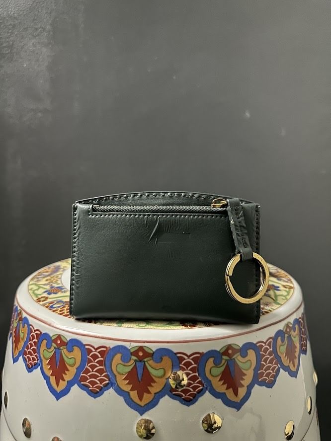 Charles & Keith Dark Green Small Wallet (Category: Wallets & Card holders) located in Caloocan City. Submitted by zealgem_d3432f (Listing ID 1463528548, Image 2). Description: - Dark green Charles & Keith wallet - Small and easy to carry - Features a ring on the side - Ideal for organizing cards and coins - Simple and practical design Please feel free to message me if there are any inquiries or requests for more pictures ❤️. .