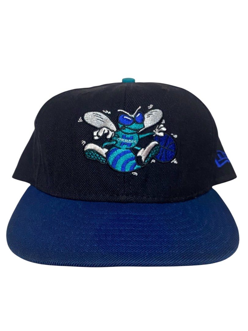 Charlotte Hornets New Era Baseball Cap (Category: Caps & Hats) located in Manila. Submitted by jco_senty (Listing ID 1463461495, Image 1). Description: - Classic Charlotte Hornets cap - Features iconic Buzz mascot embroidered on the front - Black crown with a blue brim - New Era branding on the side - Ideal for Hornets fans and collectors - Show your team spirit in style.