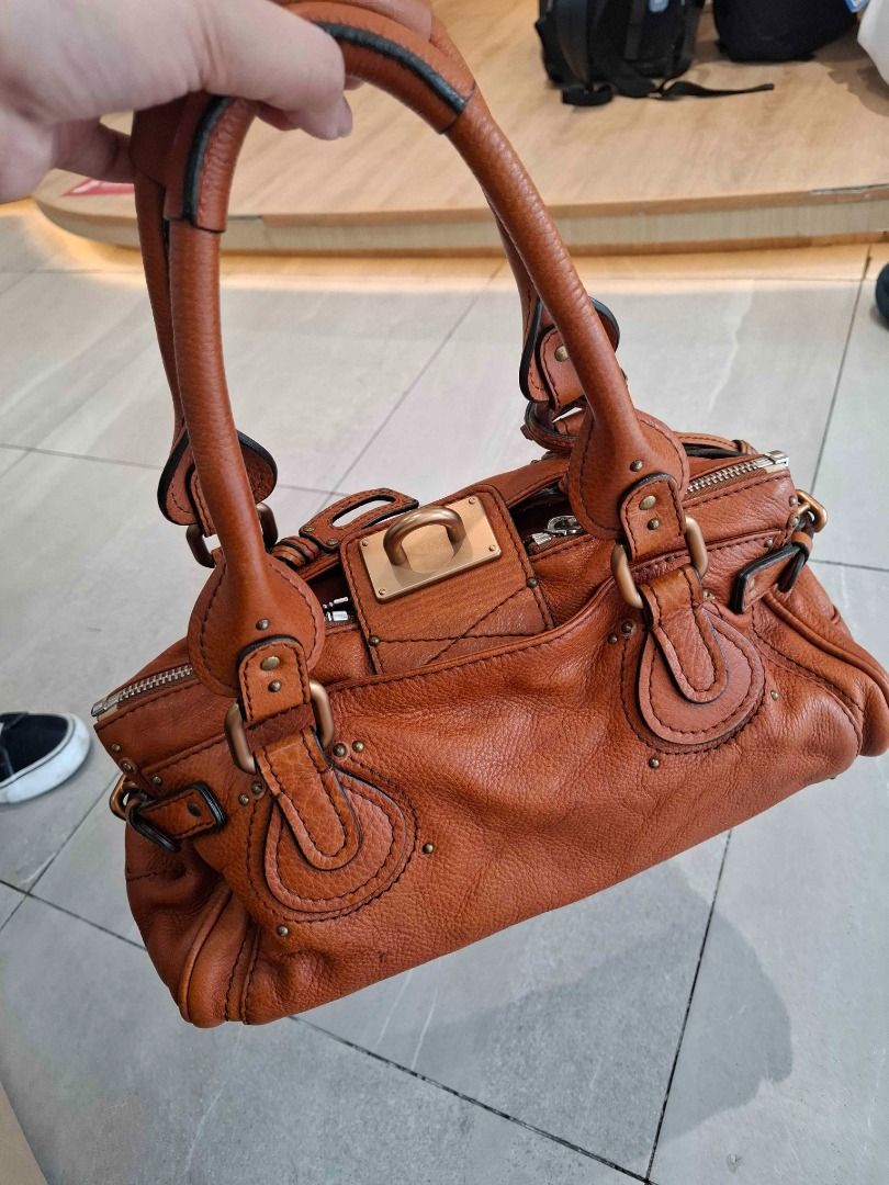 Chloe Paddington (Category: Luxury Bags & Wallets) located in Manila. Submitted by mlgrz (Listing ID 1463482804, Image 1). Description: - YKK Zipper - Genuine Heavy Leather - Has code (2006 bag) - Cognac, Burnt Orange, or Ecureuil Brown Color RFS - Used once or twice - Just stored in closet (with plastic) - Lost lock Price is negotiable for sure buyers.