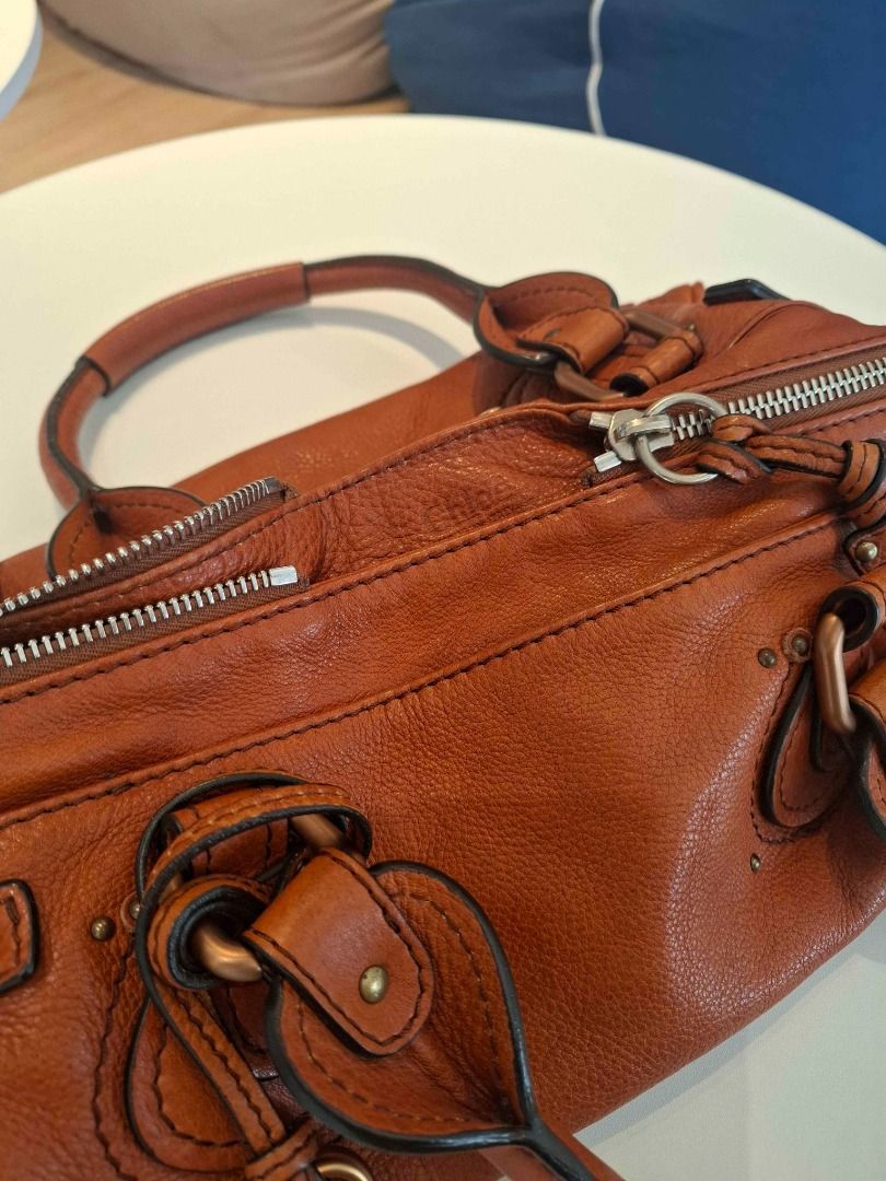 Chloe Paddington (Category: Luxury Bags & Wallets) located in Manila. Submitted by mlgrz (Listing ID 1463482804, Image 2). Description: - YKK Zipper - Genuine Heavy Leather - Has code (2006 bag) - Cognac, Burnt Orange, or Ecureuil Brown Color RFS - Used once or twice - Just stored in closet (with plastic) - Lost lock Price is negotiable for sure buyers.