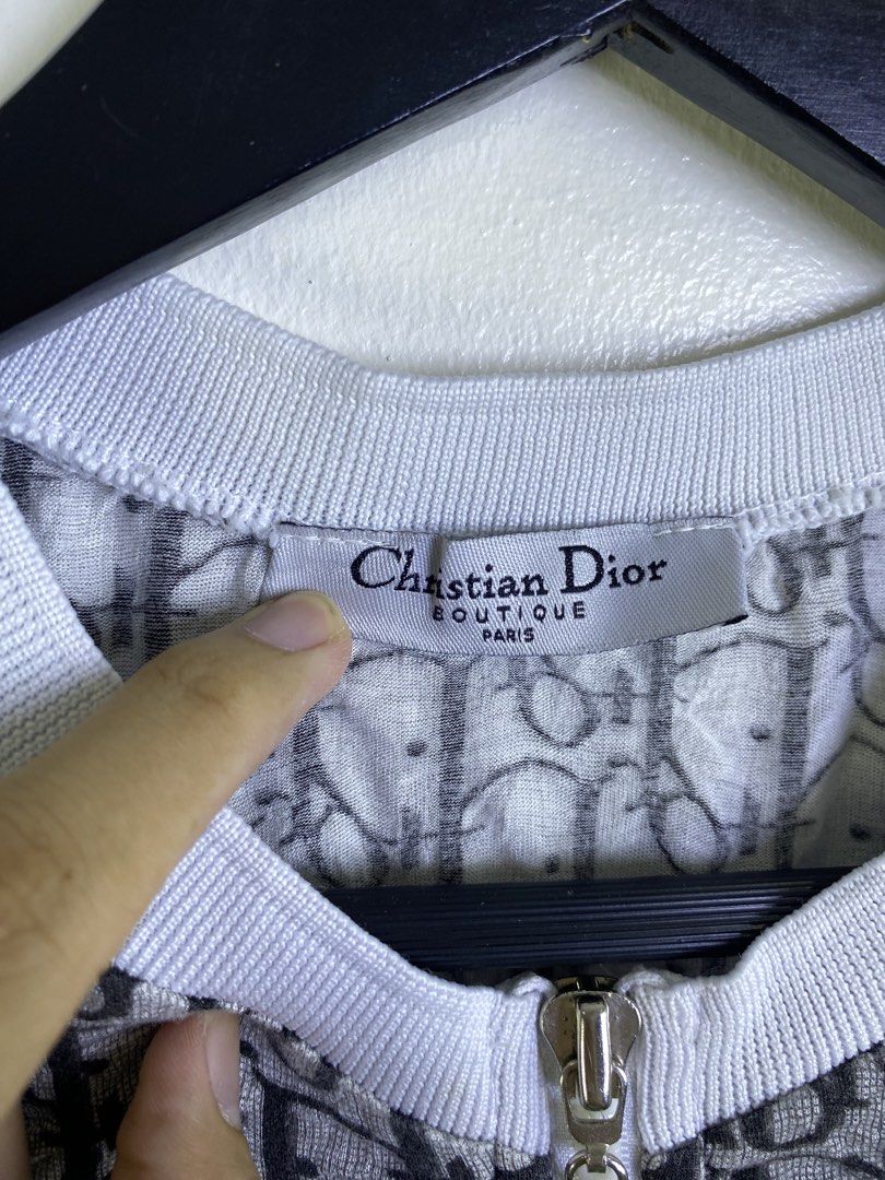 Christian Dior Monogram Track Jacket (Category: Coats, Jackets and Outerwear) located in Manila. Submitted by declutterpromax (Listing ID 1463400021, Image 2). Description: - Classic Dior monogram track jacket - Features iconic all-over Dior print - White trim on collar, cuffs, and hem - White stripe detail down the sleeves - Made from 100% cotton - Care instructions available on tag - A must-have for fashion enthusiasts.