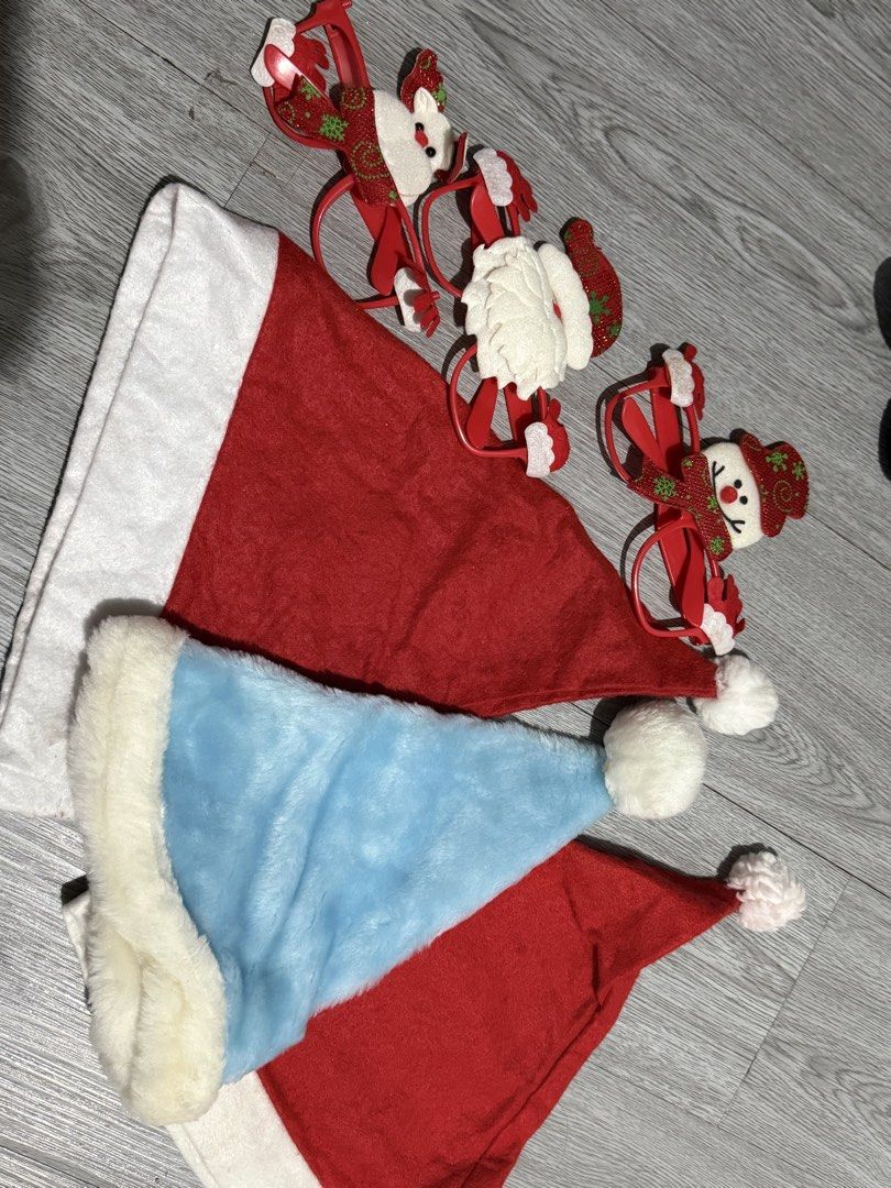 Christmas Decor and Santa Hats Bundle (Category: Plushies & Soft Toys) located in Marilao. Submitted by sweetalpuerto (Listing ID 1463551371, Image 2). Description: Selling a bundle of Christmas decorations. Includes a cute snowman plush toy and a Santa plush toy. Also comes with three festive Santa hats, one in blue and two in red. Great for holiday parties or decorating your home..