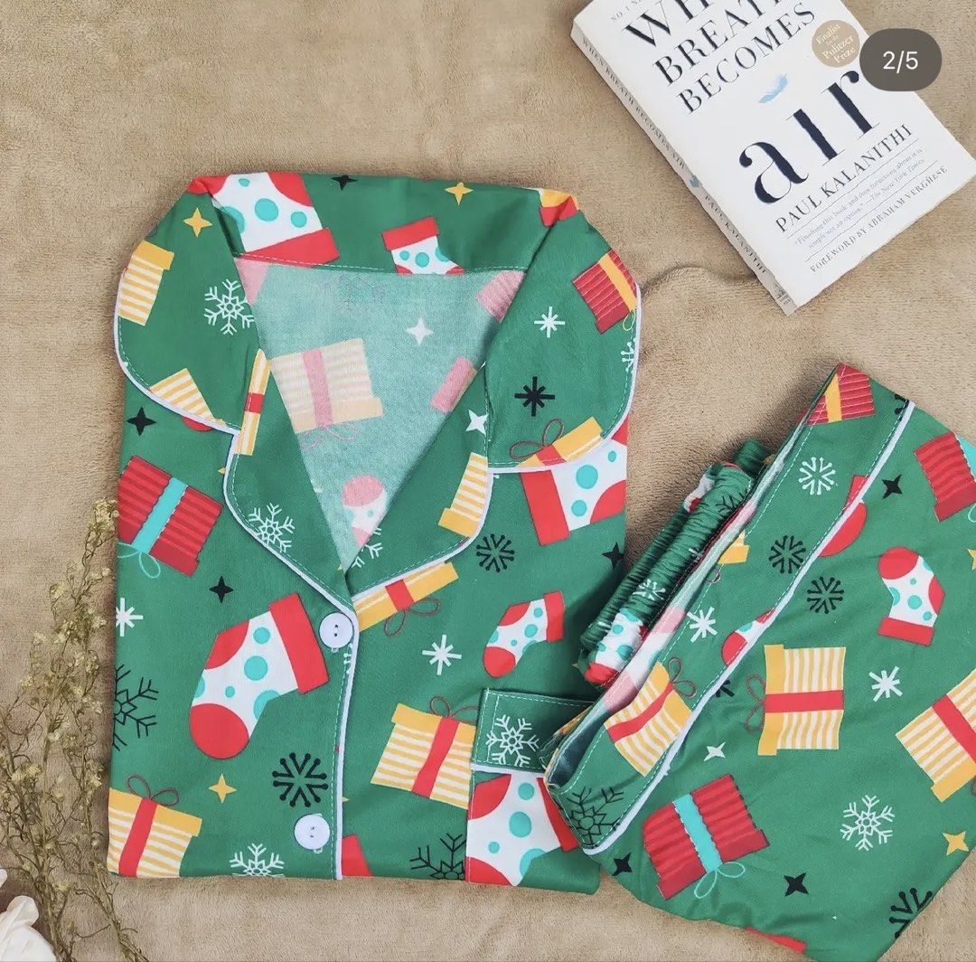 Christmas Sleepwear Shorts terno Set (Category: Undergarments & Loungewear) located in Manila. Submitted by chavirly (Listing ID 1463554115, Image 3). Description: - Festive Christmas Sleepwear Set - Available Prints: Santa Claus & Snowflakes and Green with Stockings & Gifts - Features: Short sleeves and button-up top with shorts terno - Material: Soft fabric for ultimate comfort - Perfect for: Holiday lounging, Christmas morning, or as a thought