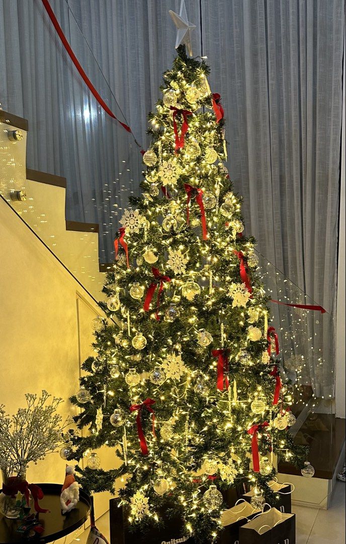CHRISTMAS TREE 8FT WITH ORNAMENTS AND LIGHT (Category: Other Home Decor) located in Bulacan. Submitted by declutteringm0m (Listing ID 1463374938, Image 1). Description: LIKE NEW super ganda and punong puno ng lights lahat ng ornaments kasama .