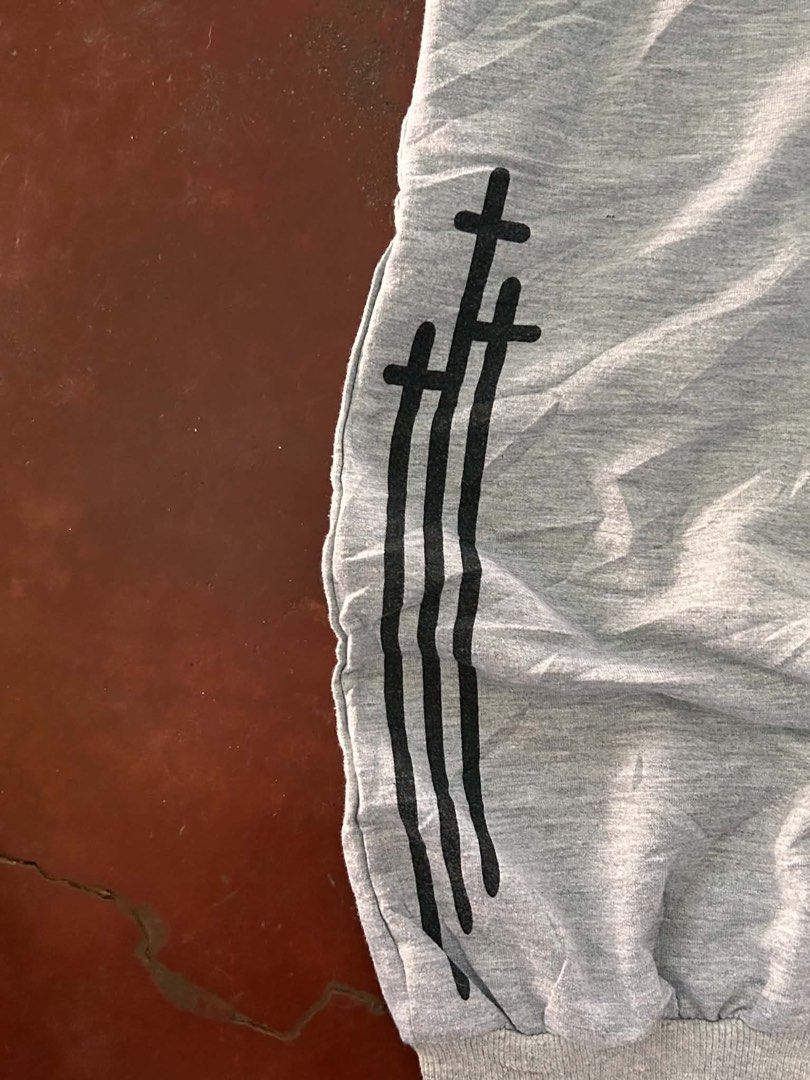 Chrome Hearts Grey Sweatpants (Category: Joggers) located in Manila. Submitted by bud_thriftt (Listing ID 1463398052, Image 3). Description: - Grey sweatpants with iconic Chrome Hearts logo on the side. - Stylish star graphics running down the leg. - Unique cross design featured on the back pocket. - Comfortable elastic waistband with adjustable drawstring. - Finished with cuffed ankles for a snug fit. - Designed for a comfortable and relaxed fit