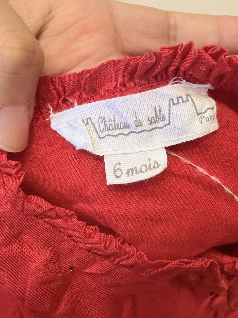 Château de Sable Red Dress 6 mois (Category: Dresses) located in San Juan, Ilocos Sur. Submitted by bpambid (Listing ID 1463343953, Image 3). Description: - Brand: Château de Sable - Color: Red - Size: 6 months - Features: Ruffled neckline and hem, all-over sparkle fabric - Condition: Gently used - Occasion: Perfect for parties or special occasions.