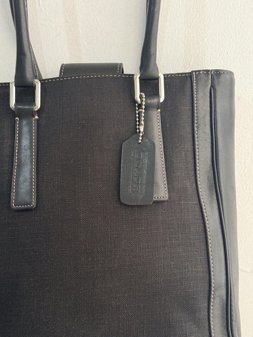 Coach Black Canvas Leather Trim Tote Bag (Category: Luxury Bags & Wallets) located in Las Pinas. Submitted by tati_finds (Listing ID 1463383689, Image 3). Description: - Classic black Coach tote bag - Durable canvas body with elegant leather trim and handles - Stylish silver hardware accents - Includes authentic Coach leather hang tag - Ample interior space for all your essentials - Ideal for everyday wear and versatility.